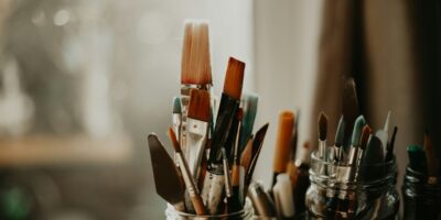 mason jars filled with paint brushes